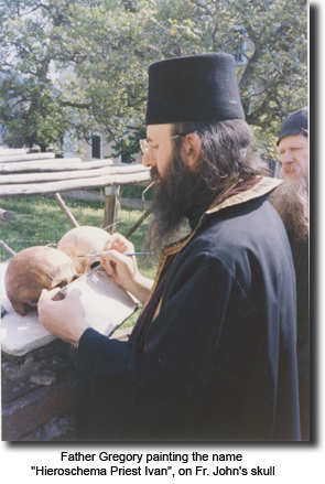 Father Gregory painting the name “Hieroschema Priest
      Ivan”, on Fr. John’s skull