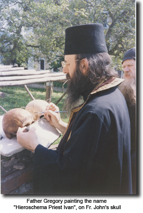 Father Gregory painting the name “Hieroschema Priest
      Ivan”, on Fr. John’s skull