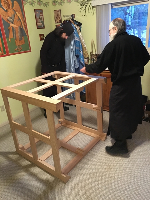 Cutting off the excess to make the pegs flush with the
    table.