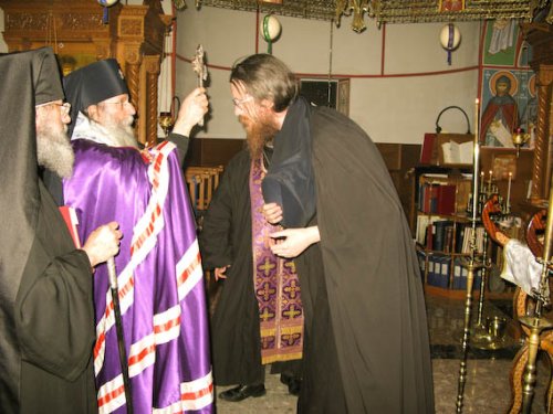 Bishop Elect John is being blessed by the Hierarchs.