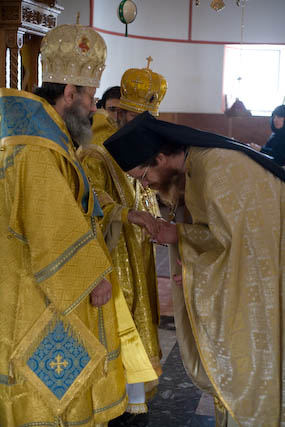 Bishop Elect John receiving the blessing from the hierarchs before his
          confession of Faith.