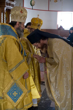 Bishop Elect John receiving the blessing from the hierarchs before his
          confession of Faith.