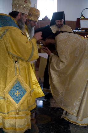 Bishop Elect John again receiving the blessing at the end of his
          confession of Faith.
