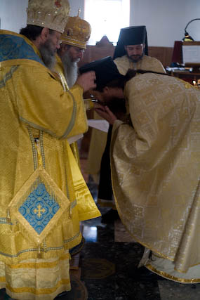 Bishop Elect John again receiving the blessing at the end of his
          confession of Faith.