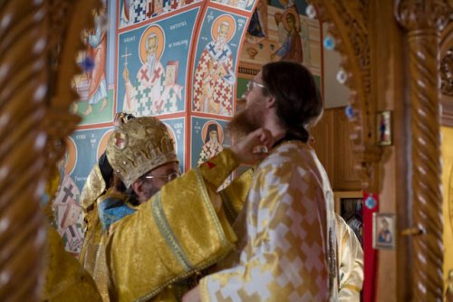 Bishop John being vested with the Sakkos.