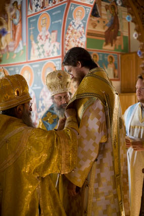 Bishop John being vested with the Omophorion.