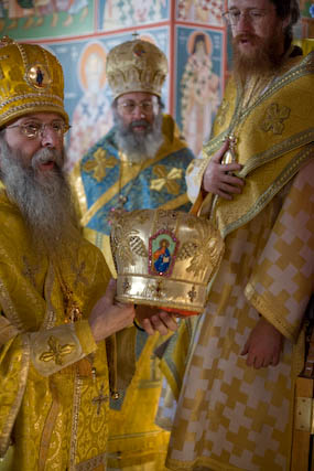 Bishop John being given the mitre. Axios! Axios! Axios!