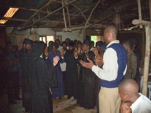 The Clergy with upraised hands, renouncing Cyprianism and Ecumenism the second
    time.