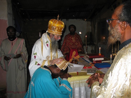 Ordaining Deacon Theophile to the Priesthood.