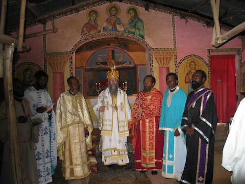 A Photo of all the Concelebrants after the Divine Liturgy. Left to Right:
    Deacon Timothy, the new Priest Theophile, Father Chrysostom, Vladyka, Father John, Father
    Athanase, and the newly ordained deacon Sylvester.