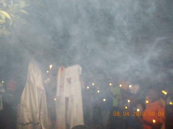 The procession in the incense smoke by night