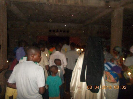 The faithful inside the church at the start of the Paschal service