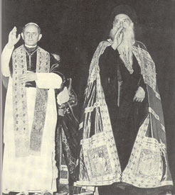 Pope Paul VI and
  Pseudo-Patriarch Athenagoras give their episcopal ‘blessing’ at the end of the Papal
  Mass.