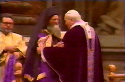 Demetrios gives fraternal kiss
  at the consecration of the wafer.