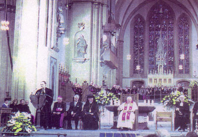 Metropolitan Augustinos
  (Lampardakкs) of Germany participates in a Lutheran church service along with various
  papist bishops and cardinals.