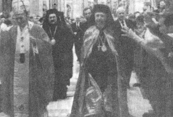 Athanasios of
  Heliopolis and Thera leaving a concelebration with Pope John Paul II (June 28, 1994).