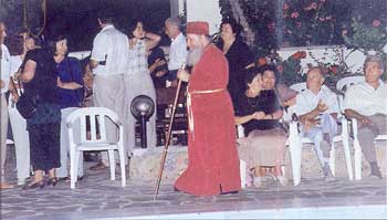 Metropolitan Nektarios
  of Kalymnos [EP], dressed, appropriately enough, like a Roman Catholic Cardinal.