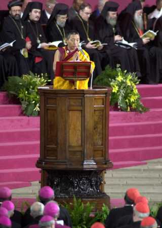 A Buddhist monk chants a traditional prayer for the soul's success in merging with the
  “All” and escaping the cycle of reincarnation for the participants in the
  Pope’s “Day of Prayer for World Peace” in Assisi, Italy, 2002. All religions
  participated together in this insane event, followed by a separate communion service for all
  ‘Christian’ participants. All the Patriarchates sent their representatives, some of
  whom can be seen behind the Buddhist above.