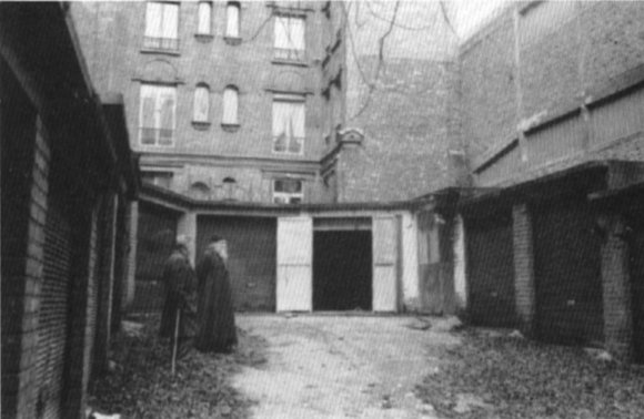 Archbishop John’s Paris “Cathedral,” actually a
  garage church, in the 1950’s. Before it stands Fr. Mitrophan, a disciple of Archbishop
  John.